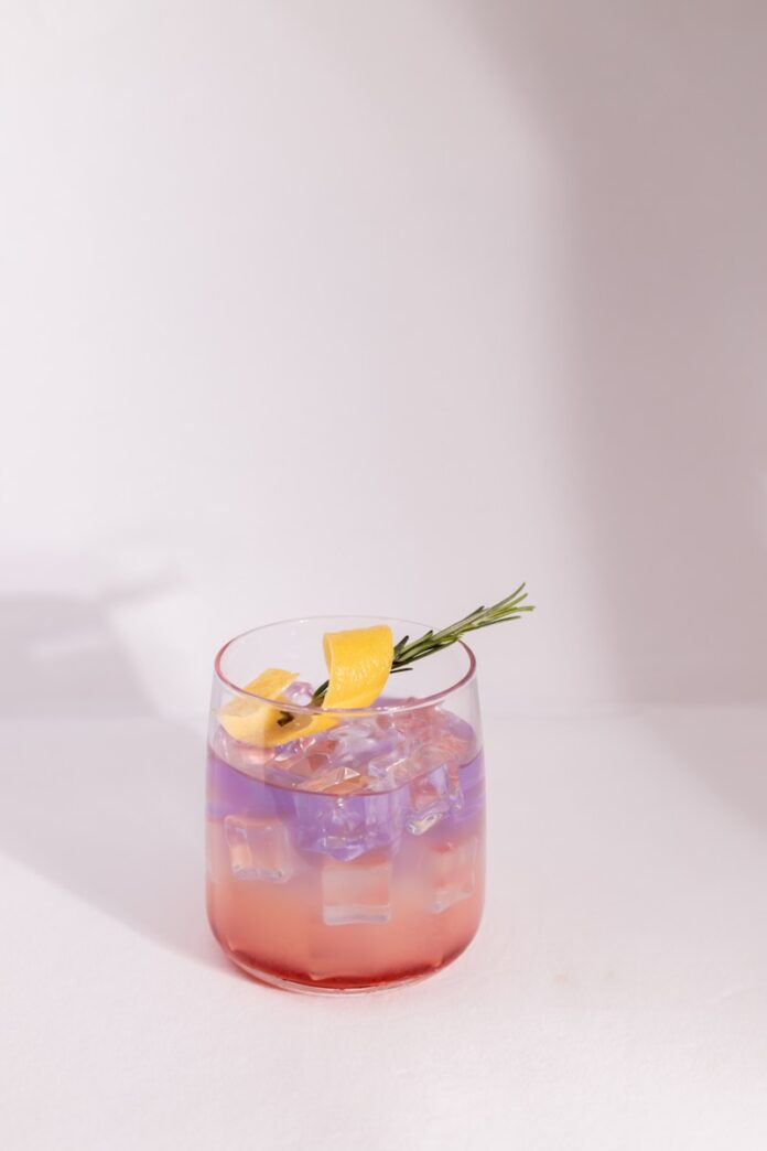 Photo by Ronnarit Jirathanyakorn a glass with a drink in it