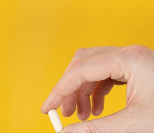 뼈 건강을 지키는 첫걸음, 골다공증 예방의 중요성과 실천법 person holding white cigarette stick