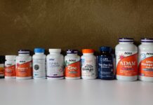 영양 가득한 한 끼, 스마트하게 챙기는 보충제 활용법 a row of bottles of different types of vitamins