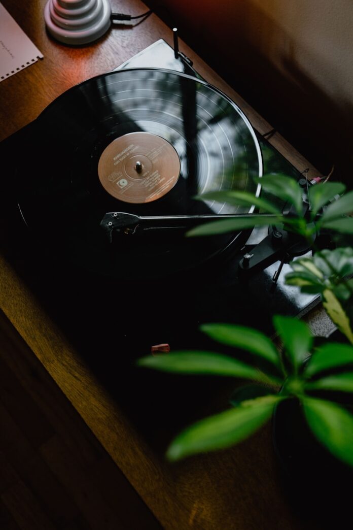 Photo by Kevin McCutcheon black turntable on brown wooden table