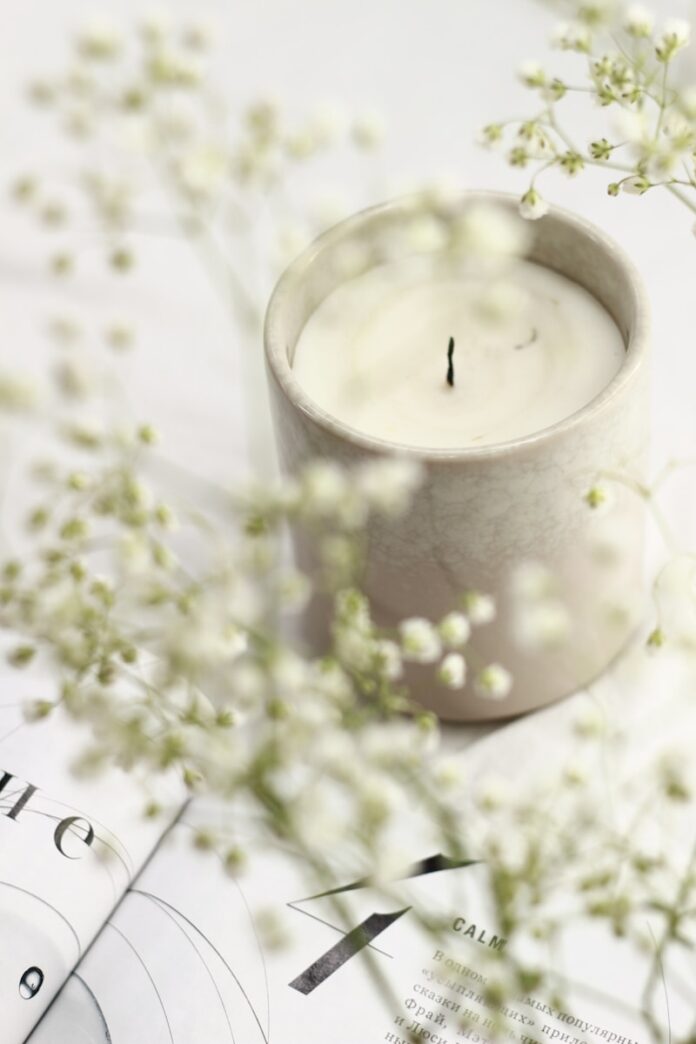 Photo by Anastasia Anastasia white candle in clear glass holder