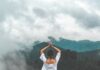 마음과 몸의 조화: 웰니스 회복으로 삶의 활력을 되찾자 woman standing on rock facing forest