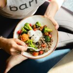 내 몸에 맞는 식단, 건강하게 시작해볼까요? a woman is holding a bowl of food